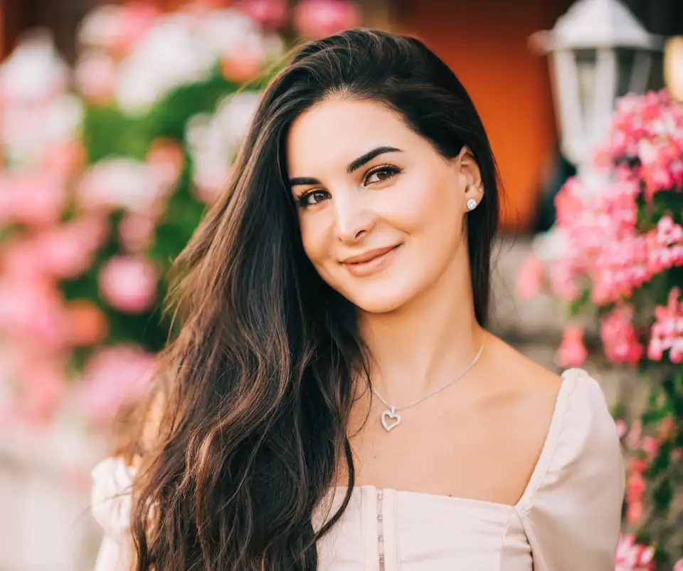 healthy skin with no down time model smiling in a field of flowers in raleigh nc